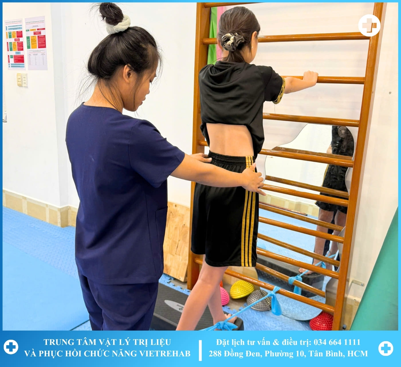 A therapist working with a patient on a rehabilitation machine with greenery in the background