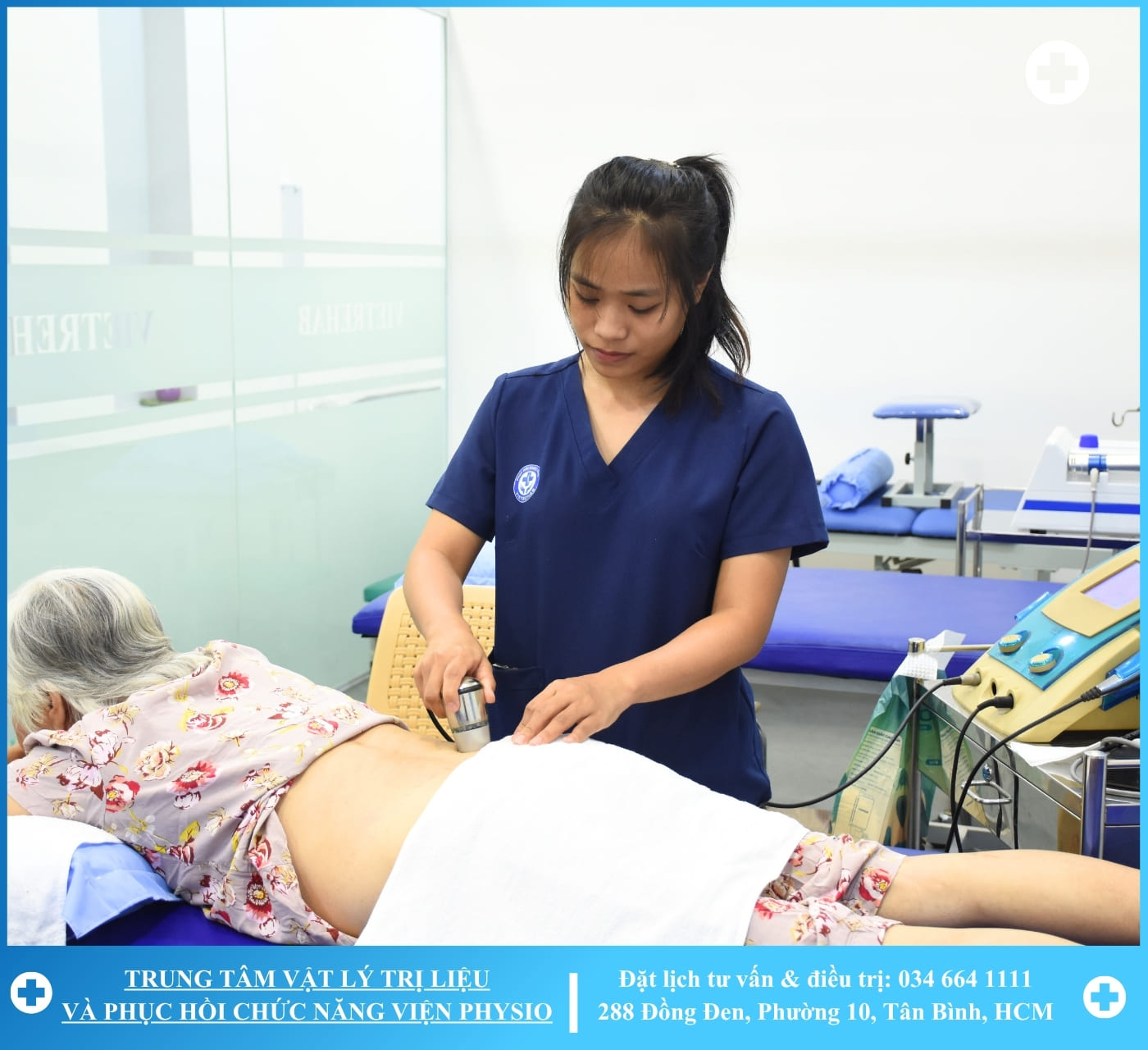 A therapist working with a patient on a rehabilitation machine with greenery in the background
